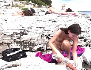 100522_hot_brunette_rebeka_ruby_masturbating_with_a_dildo_on_a_public_nude_beach_while_her_friends_sunbathe_nude_miss_pussycat_sammy_adriana